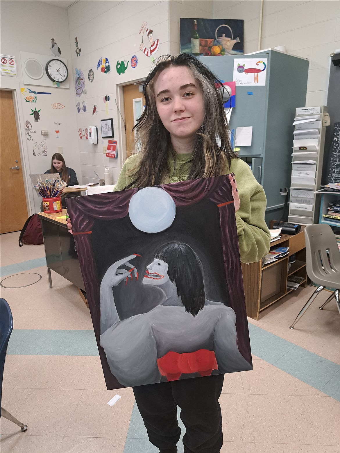 Zuken Garcia shows off one of their art pieces that will be in the Lake City High School student art show, "Gallery ‘24 – Beauty in the Dark Places, and Running Out of Time,” which will be from 4-7 p.m. Tuesday in McEuen Park.