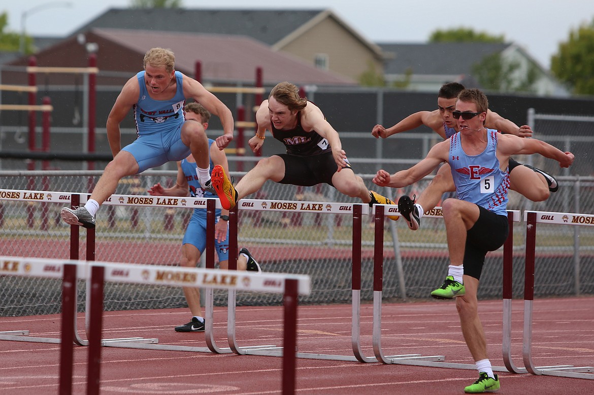 Moses Lake senior Blazer Luiten, in black, competes in the 110-meter hurdles during an April 25 league meet at Moses Lake High School.