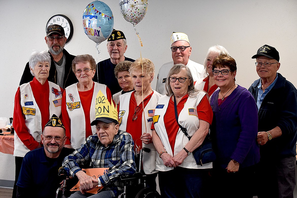 Libby Care Center resident Don Engel is surrounded by members of the local VFW and American Legion chapters during his 102nd birthday party on Thursday, May 2. Engel served as a bombardier and navigator on B-26 bombers during World War II. (Scott Shindledecker/The Western News)