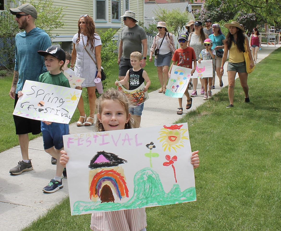 Families walk from the Kalispell library to the Spring Festival at the Conrad Mansion grounds in 2023. (Courtesy of Lune Axelsen)