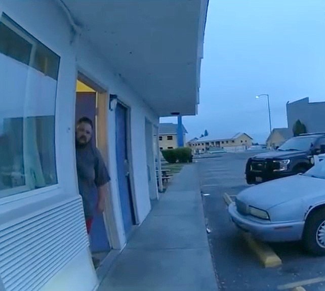 Suspect Zachary Stockton looks out the door during an officer-involved shooting incident May 4 in Moses Lake.