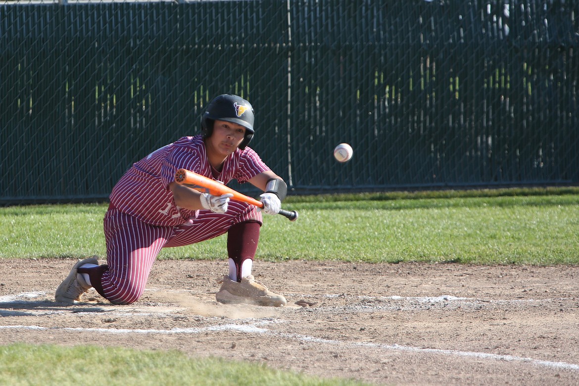 Moses Lake sophomore Daniel Baez lays down a bunt, tying the game at one in the bottom of the second inning against Eastmont.