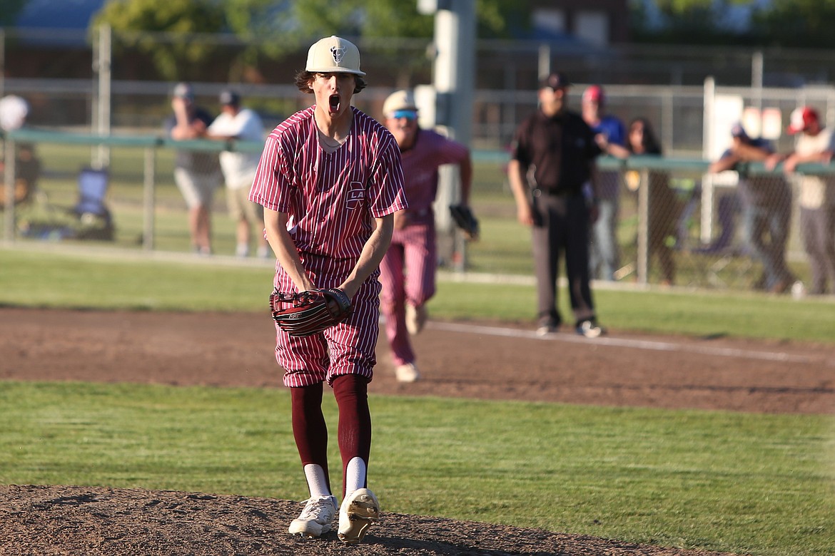 Moses Lake freshman Dagen Enquist yells out in celebration after throwing the game’s final out.