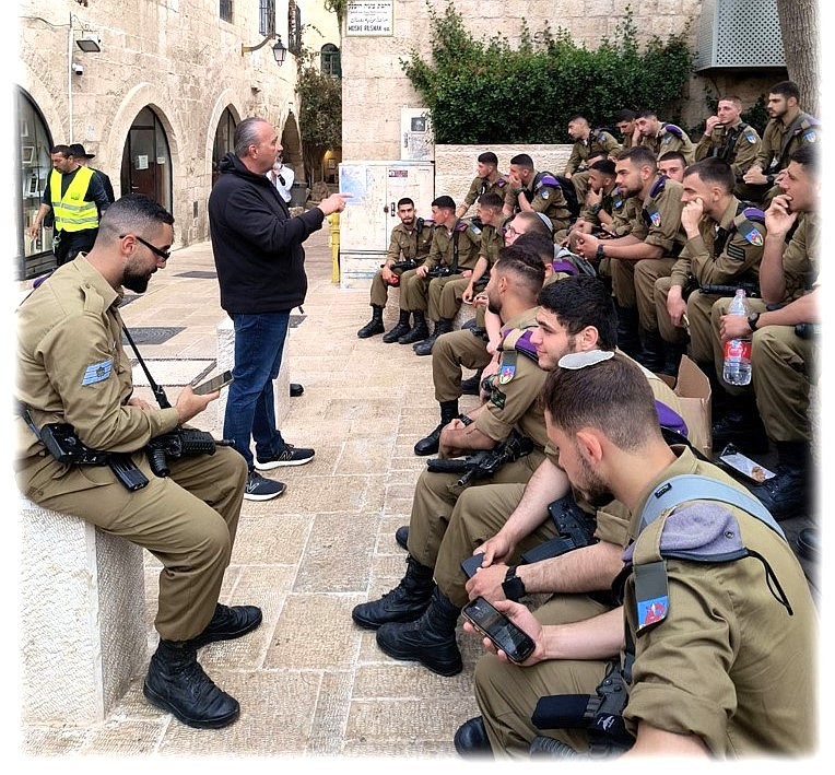 Pastor Paul Van Noy talks to members of the Israeli military on a trip to Israel in April.