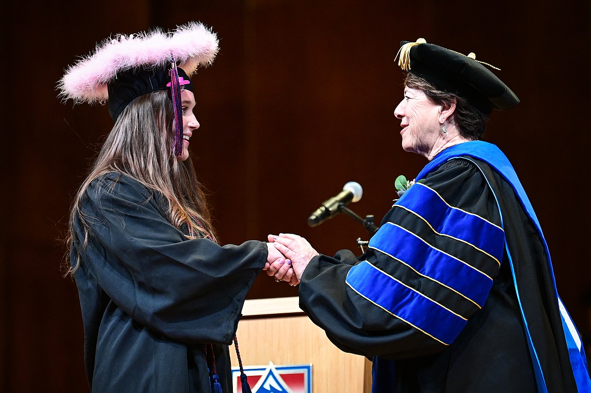 Flathead Valley Community College President Jane Karas shakes the hand of a graduate after receiving her degree at FVCC's Class of 2024 commencement ceremony inside McClaren Hall at the Wachholz College Center on Friday, May 10. A total of 271 students were honored earning 292 degrees and certificates. (Casey Kreider/Daily Inter Lake)