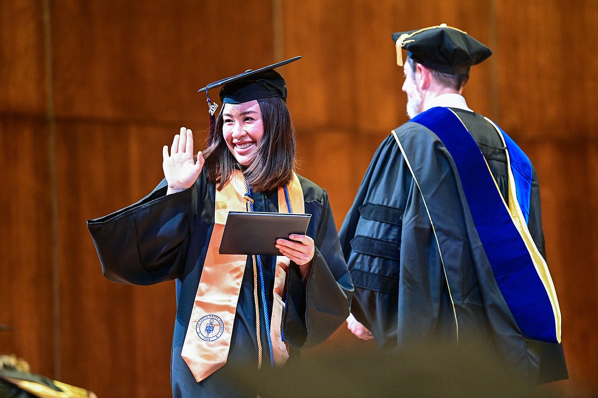 A graduate smiles after receiving her degree from Bryan Brophy-Baermann, vice president of Academic and Student Affairs, at Flathead Valley Community College's Class of 2024 commencement ceremony inside McClaren Hall at the Wachholz College Center on Friday, May 10. A total of 271 students were honored earning 292 degrees and certificates. (Casey Kreider/Daily Inter Lake)