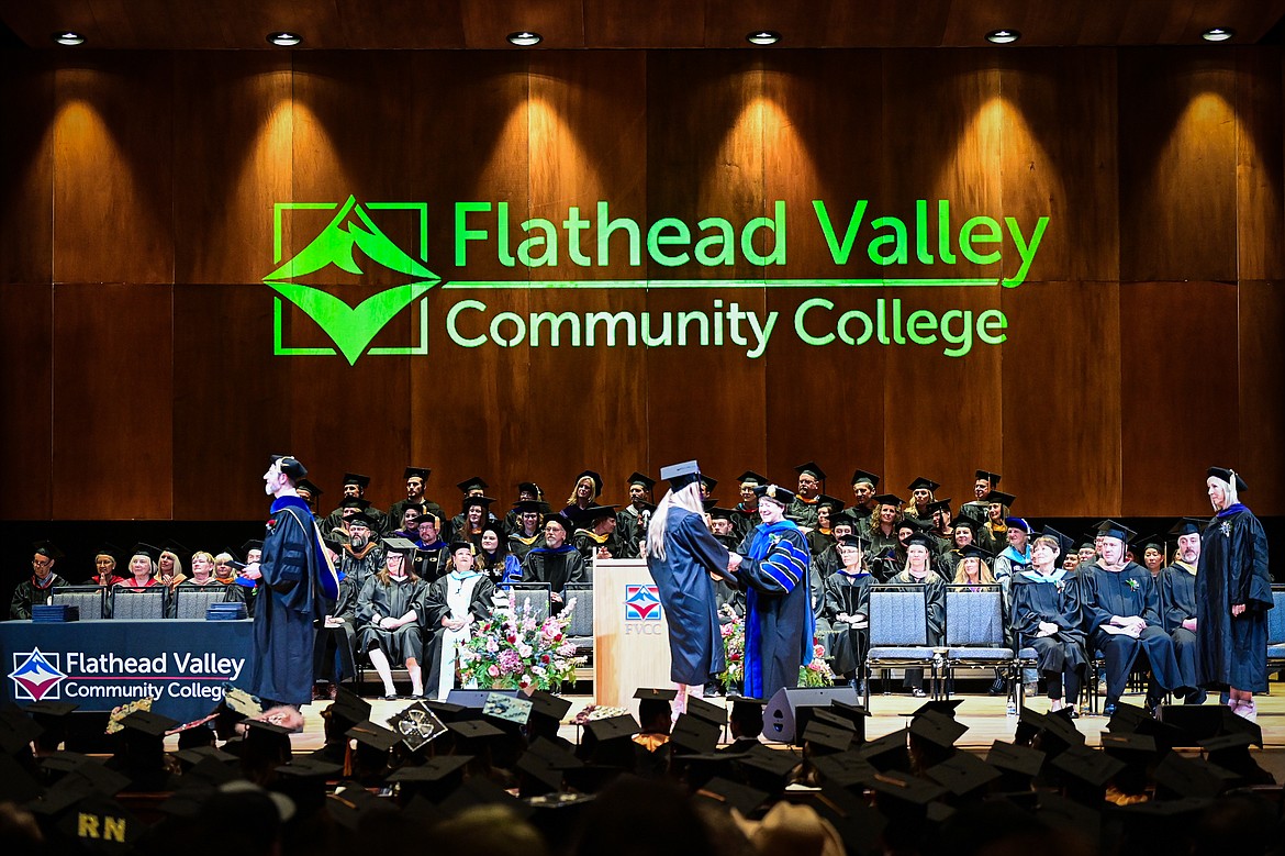 Flathead Valley Community College President Dr. Jane Karas shakes the hand of a graduate after receiving her degree at FVCC's Class of 2024 commencement ceremony inside McClaren Hall at the Wachholz College Center on Friday, May 10. A total of 271 students were honored earning 292 degrees and certificates. (Casey Kreider/Daily Inter Lake)