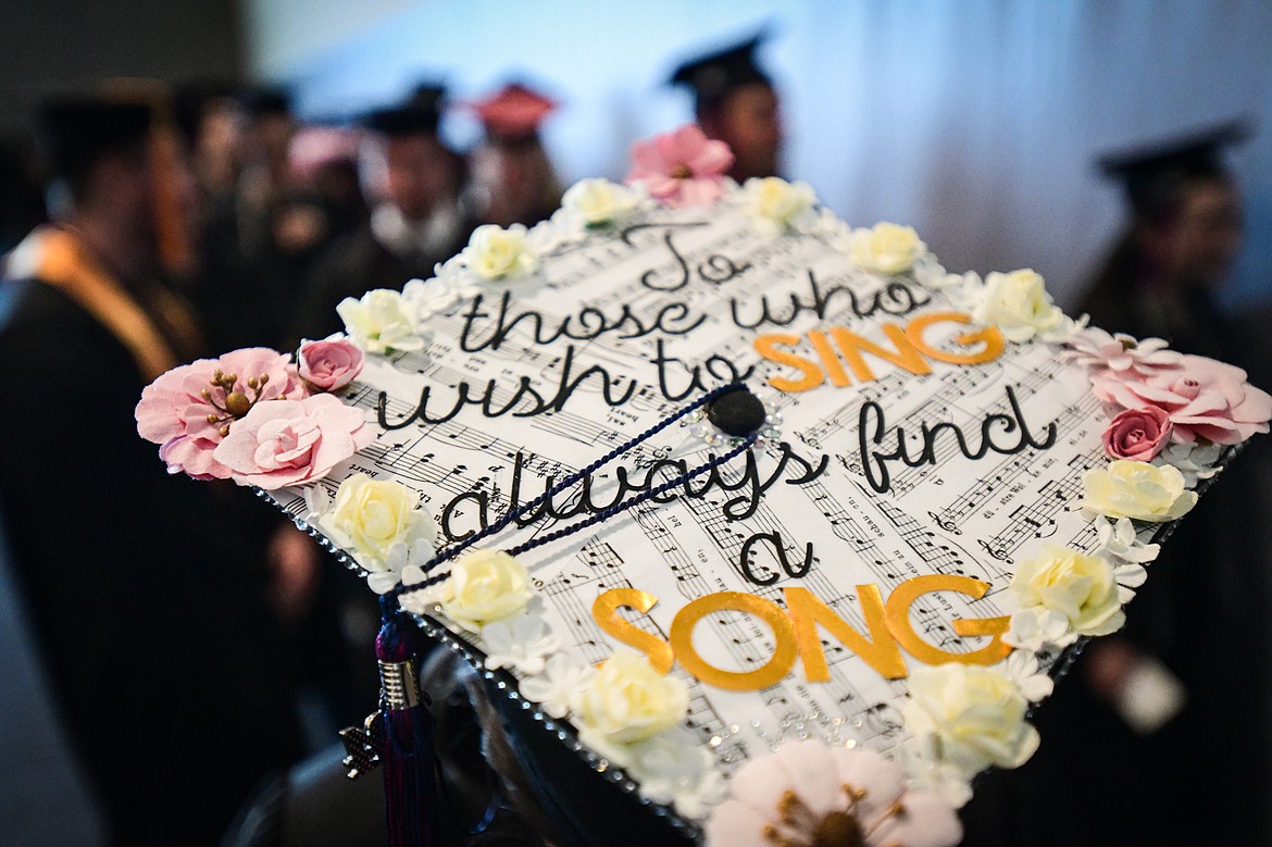 A graduate's decorated mortarboard reads "To those who wish to sing always find a song" before Flathead Valley Community College's Class of 2024 commencement ceremony inside McClaren Hall at the Wachholz College Center on Friday, May 10. A total of 271 students were honored earning 292 degrees and certificates. (Casey Kreider/Daily Inter Lake)