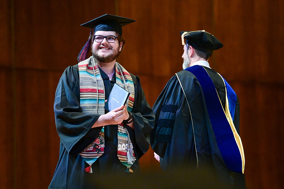 A graduate smiles after receiving his degree from Bryan Brophy-Baermann, vice president of Academic and Student Affairs, at Flathead Valley Community College's Class of 2024 commencement ceremony inside McClaren Hall at the Wachholz College Center on Friday, May 10. A total of 271 students were honored earning 292 degrees and certificates. (Casey Kreider/Daily Inter Lake)