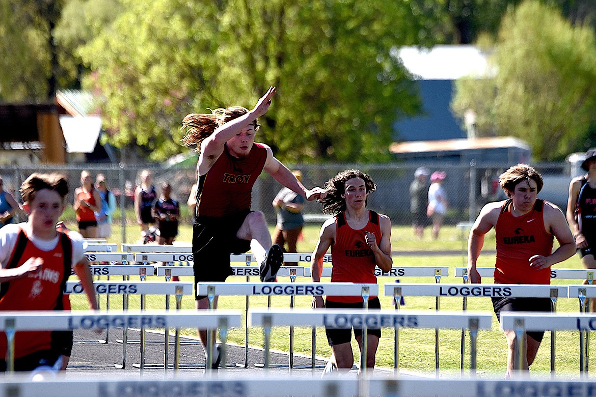 Troy's Gavin Bender competes in the 110-meter hurdles in the District 7B Meet Saturday, May 11, 2024 in Libby. (Scott Shindledecker/The Western News)