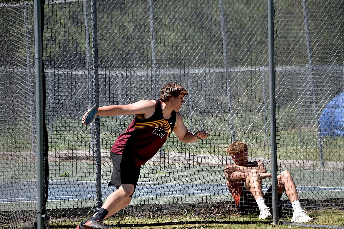 Troy's Jacob Gromley competes in the discus in  the District 7B Meet Saturday, May 11, 2024 in Libby. (Scott Shindledecker/The Western News)