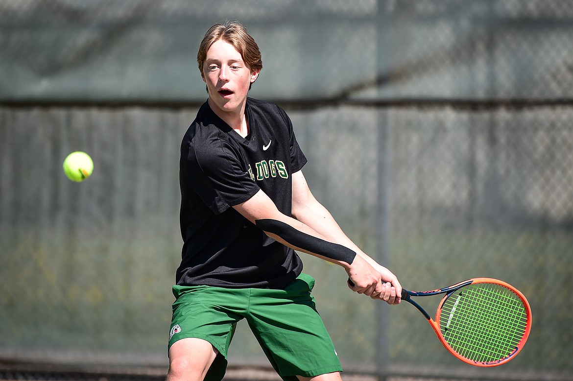 Whitefish's Jack Oehlerich hits a return in a boys singles match against Bigfork at Riverside Park in Whitefish on Thursday, May 9. (Casey Kreider/Daily Inter Lake)