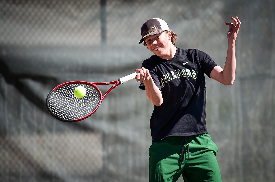 Whitefish's Owen Erickson hits a return in a boys singles match against Bigfork's Cole Carlson at Riverside Park in Whitefish on Thursday, May 9. (Casey Kreider/Daily Inter Lake)