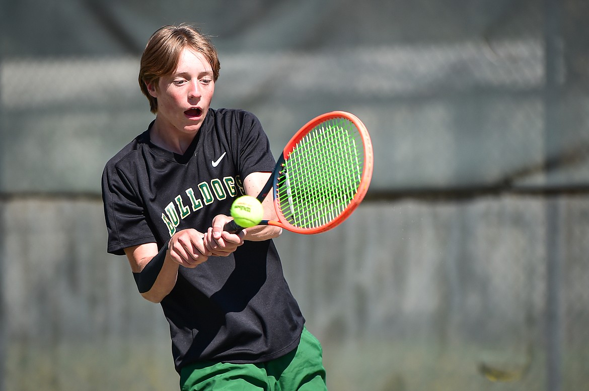 Whitefish's Jack Oehlerich hits a return in a boys singles match against Bigfork at Riverside Park in Whitefish on Thursday, May 9. (Casey Kreider/Daily Inter Lake)