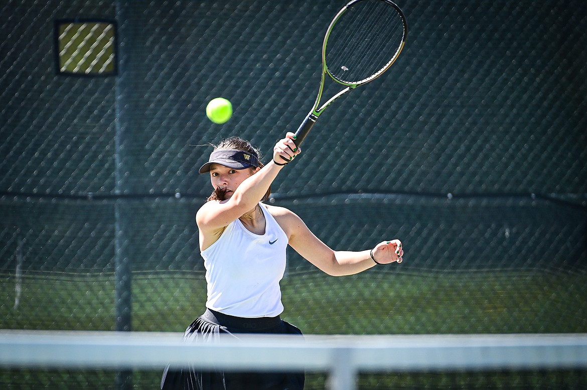 Whitefish's Alivia Lusko hits a return in a girls singles match against Bigfork's Jade Sisler at Grouse Mountain Park in Whitefish on Thursday, May 9. (Casey Kreider/Daily Inter Lake)