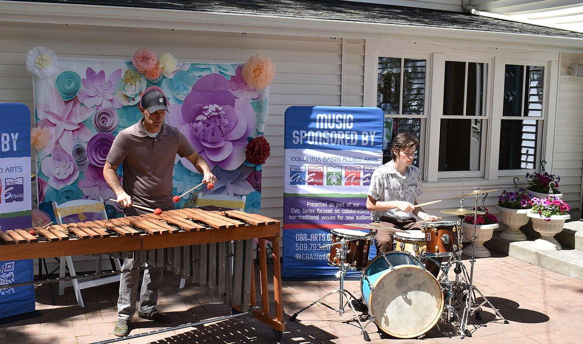 The John Owens Marimba Duo provided music for the CBAA Garden Party Saturday, giving the sun-dappled event a Caribbean air.