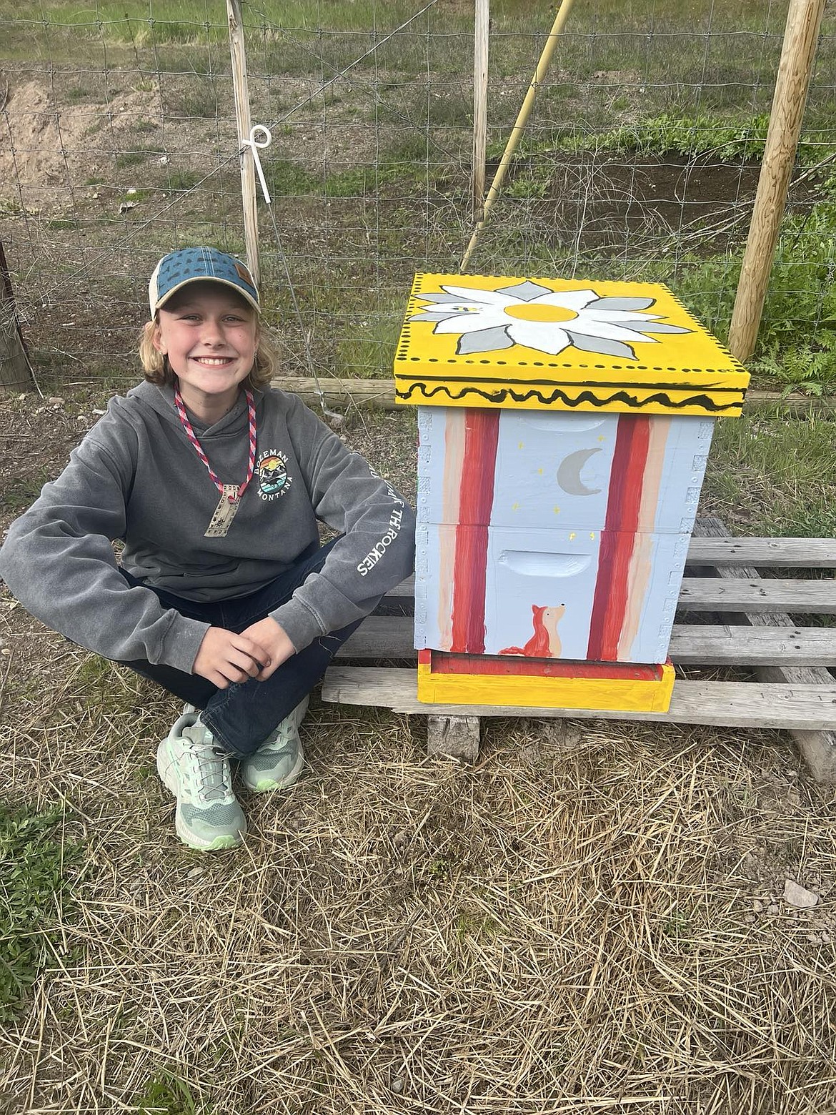 Next to her beautifully painted bee hive, Ayla Henderson received her very own colony of bees to raise and get hands-on experience while beekeeping at the Benson Homestead in Superior. (Mineral Independent/Amy Quinlivan)