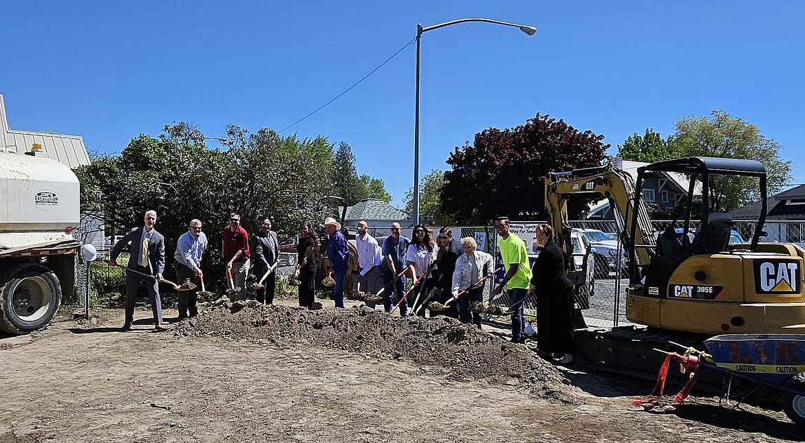 City, county, state and Coulee Medical Center officials turn over the first shovelfuls of dirt on the project to build a new Coulee Medical Clinic and Coulee City Public Library.