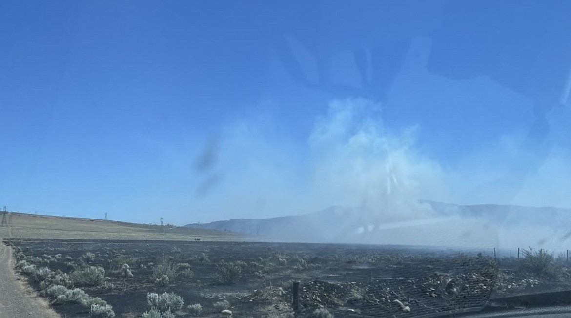 A brush fire grew to about 100 acres Monday along SR 243 near Wanapum Village.