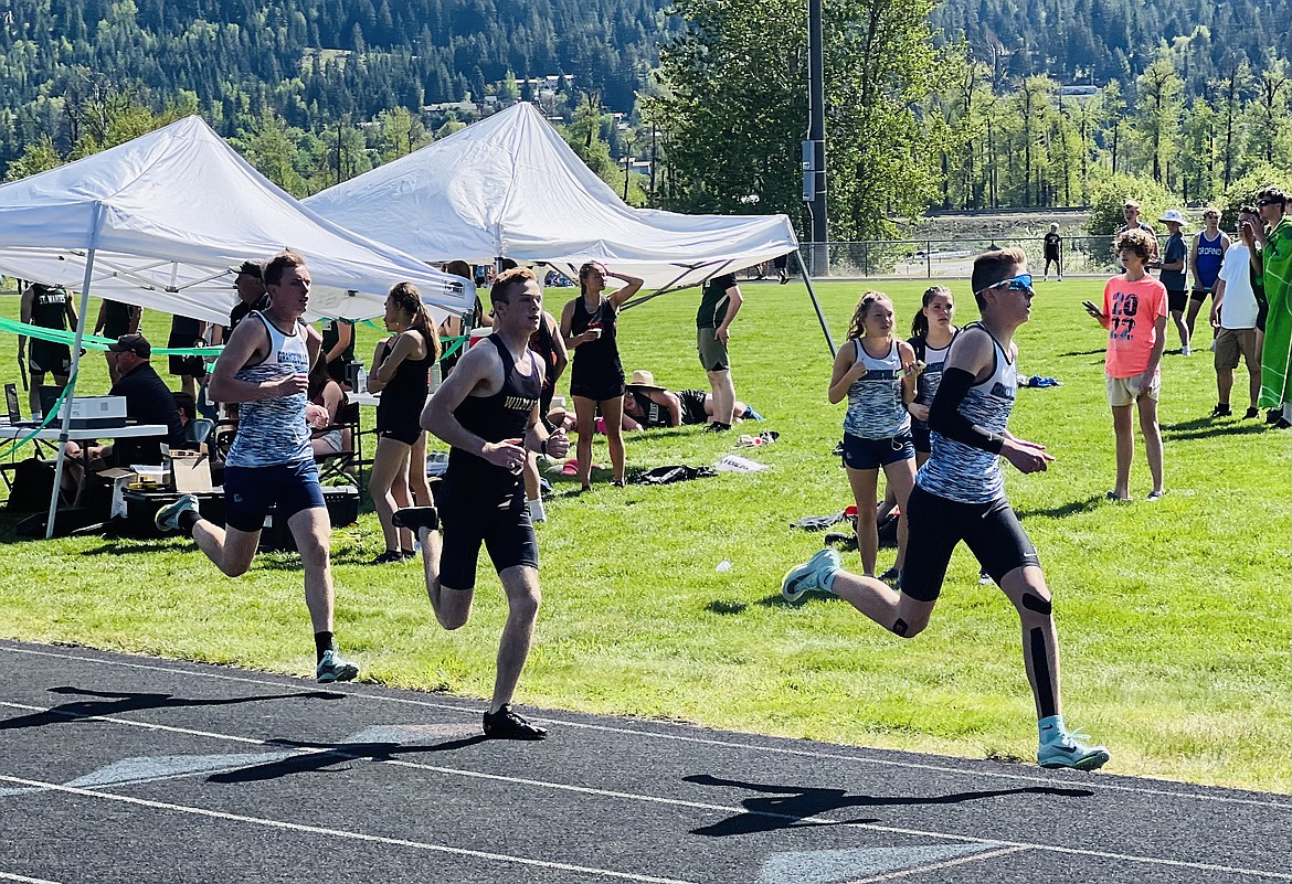 Kellogg's Ryken White (center) starts lap No. 2 on his way to the 2A District 1-2 championship in the men's 800 at St. Maries High School on Saturday.