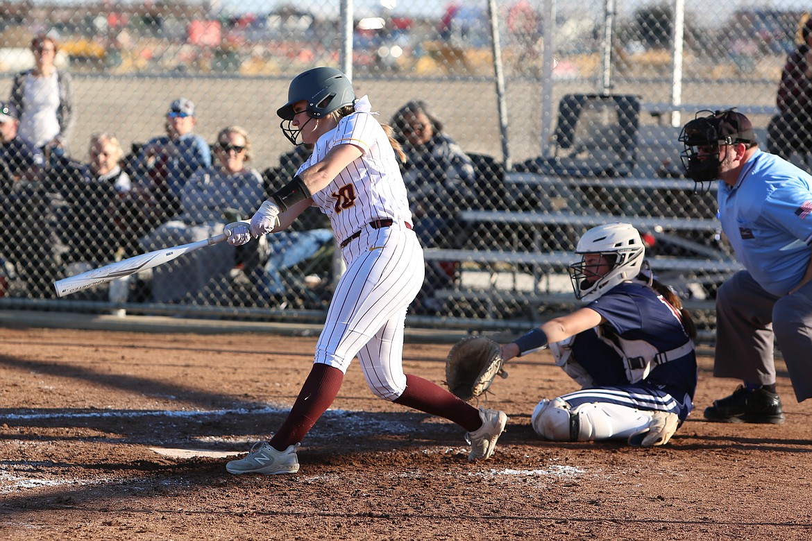 Moses Lake senior Emmie Olsen, in white, hit her second home run in as many games during the first game of Friday’s doubleheader against Eastmont, tying the game at one before the Mavs earned a 2-1 win over the Wildcats.