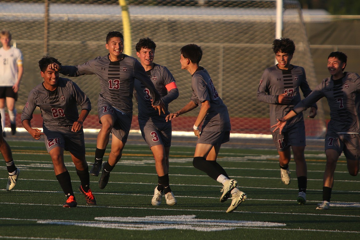 Wahluke players celebrate after junior Luis Corona (13) scored a game-tying goal in the 73rd minute.