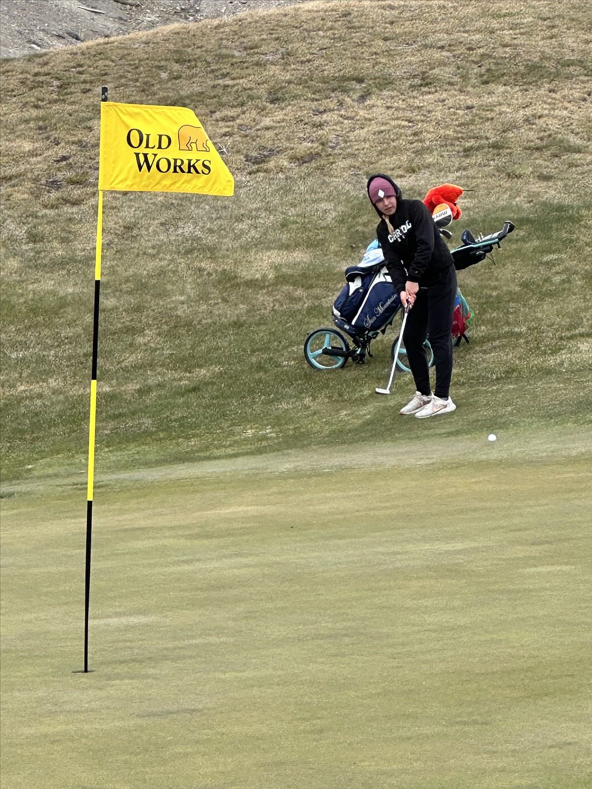 Thompson Falls golfer Solveig Nygaard putts on a green at Anaconda's iconic Old Works golf course during Western Division Class B post season play last Tuesday. (Photo by Doree Thilmony)