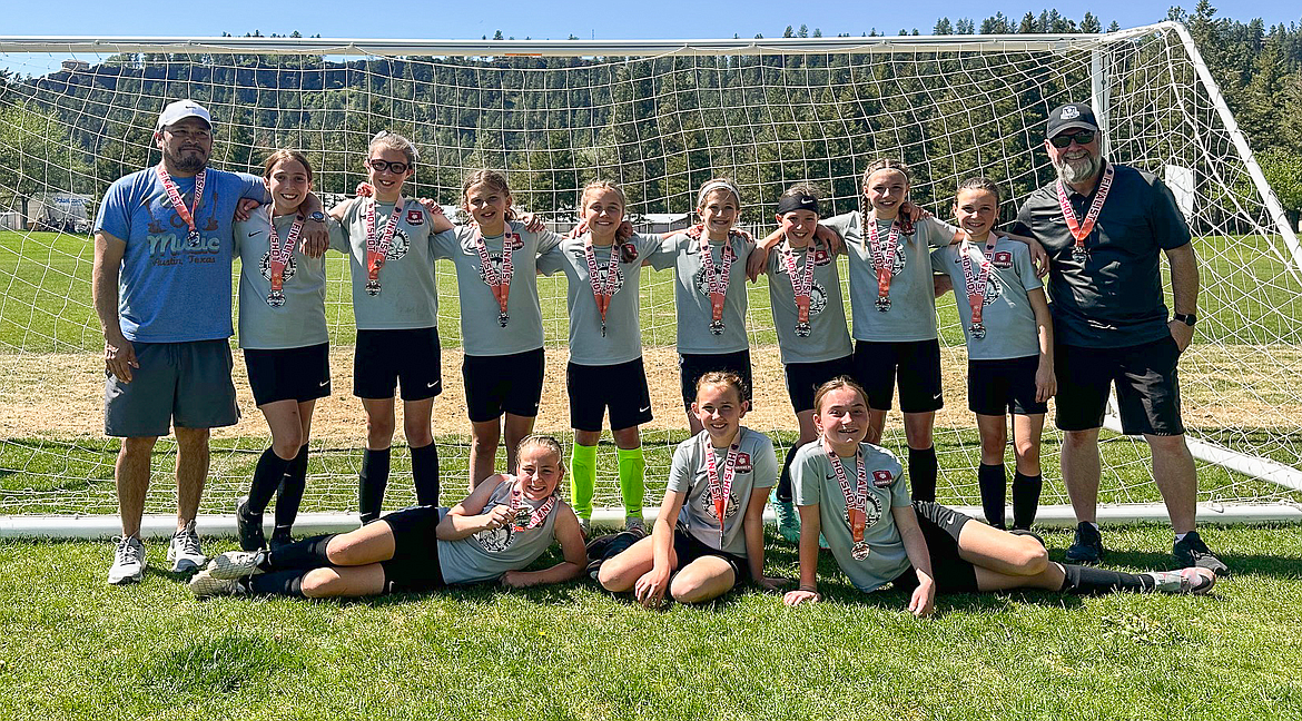 Courtesy photo
The Thorns 2013 Girls soccer team took two teams to the 33rd annual Bill Eisenwinter Hot Shot Tournament this past weekend at Plantes Ferry Park in Spokane Valley. The Gold Team took second place in the Gold Division, scoring 9 goals in 3 games, and allowing only 2 goals against. In the front row from left are Nora Schock, Evellyn Howard and and Peyton Cantrell; and back row from left, head coach Tomas Barrera, Kyal Carlson, Kinsey Kiefer, Felicity Miller, Nora Snyder, Presley Hart, Emma Storlie, Addison Salas, Nevie Sousley and assistant coach Gary Evans.