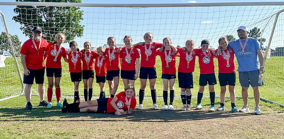 Courtesy photo
The Thorns 2013 Girls took two teams to the 33rd annual Bill Eisenwinter Hot Shot Tournament this past weekend at Plantes Ferry Park in Spokane Valley. The Silver Team took second place in the Silver Division, scoring 14 goals in 4 games. In the front is Eva Frost; and back row from left, assistant coach Gary Evans, Alexis Morisette, Sophia Quigley, Amalia Cramer, Viper Barnes, Hayden Hays, Kaylee Evans, Vera Eveland, Kinsley May, Nora Snyder, Emma Storlie, Felicity Miller, and head coach Tomas Barrera.