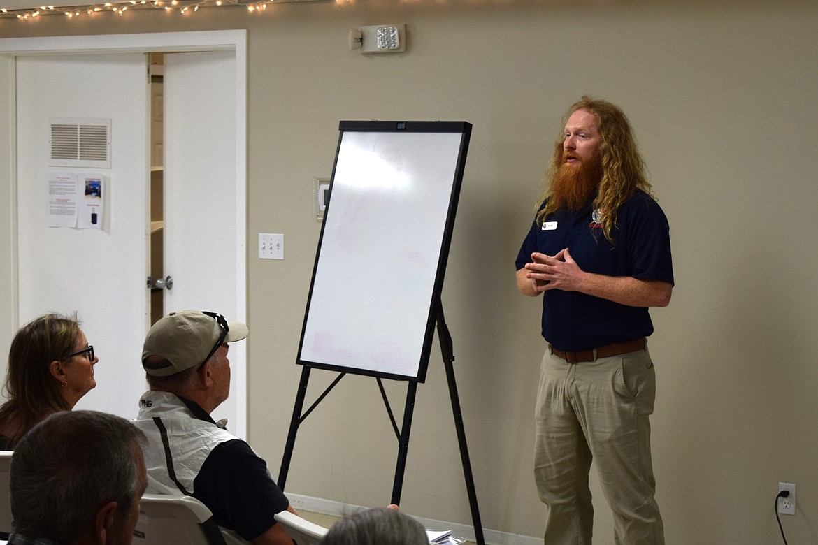 Washington Department of Natural Resources Community Resilience Coordinator Jake Hardt, standing, led the informational portion of Wednesday’s informational meeting on Desert Aire’s participation in the Wildlife Ready Neighbors program and application for status as a Firewise USA community.