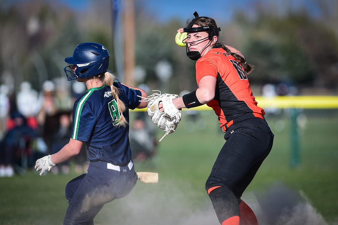 Bravettes shortstop Kaidyn Lake looks to turn two during the Crosstown game with Glacier on April 16. (Casey Kreider/Daily Inter Lake)