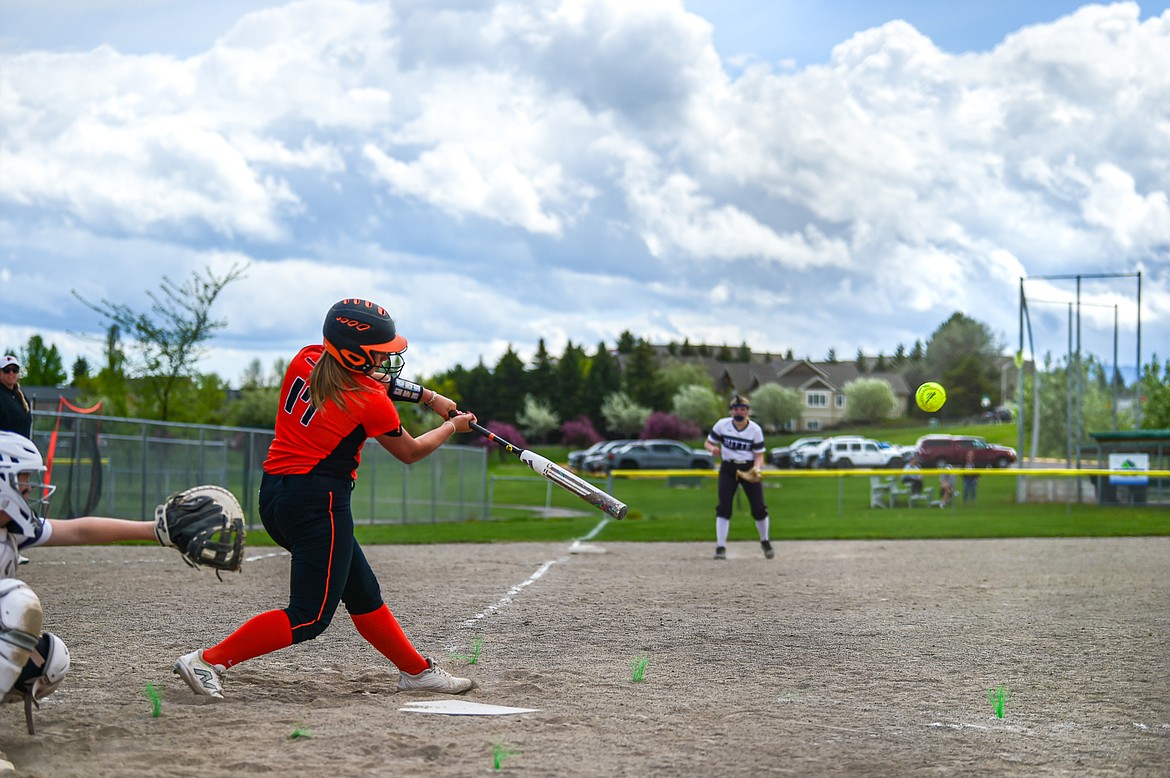 Flathead's Reese Conley (17) drives in Ava Bessen to score the game-winning run with a walkoff RBI double in the bottom of the seventh to beat Butte 5-4 at Kidsports Complex on Tuesday, May 14. (Casey Kreider/Daily Inter Lake)