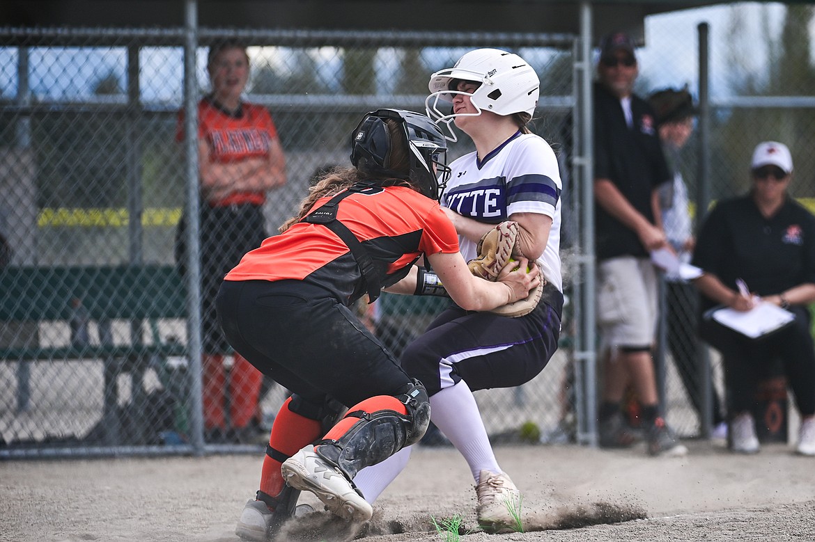 Flathead catcher Laynee Vessar (12) tags out a Butte runner trying to score at Kidsports Complex on Tuesday, May 14. (Casey Kreider/Daily Inter Lake)