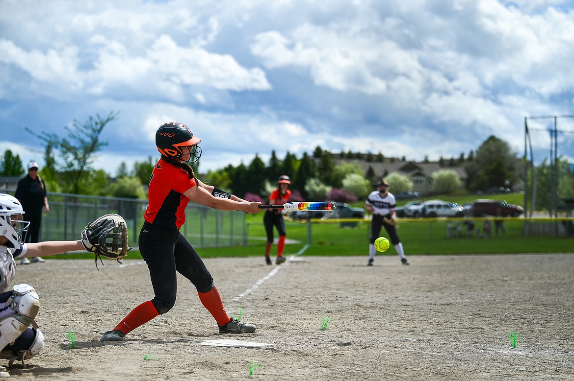 Flathead's Ava Bessen (4) drives in Kinsey Lake (9) from third to tie the game up in the bottom of the seventh against Butte at  Kidsports Complex on Tuesday, May 14. (Casey Kreider/Daily Inter Lake)