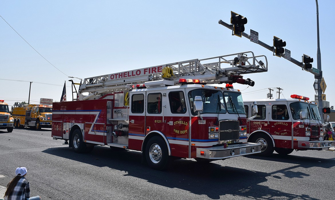 Adams County Fire District 5 staff members operate city of Othello fire engines during the 2023 July 4 parade down main street, followed by ACFD 5’s yellow Adams County vehicles. The city of Othello gave two-year notice of termination of its contract with ACFD 5 May 8.