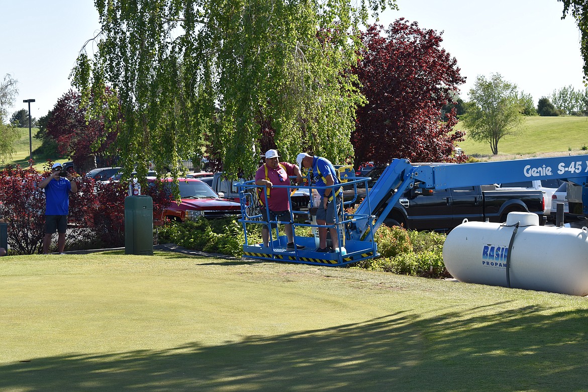 The Genie Ball Drop is a recurring game they play at the Chamber Golf Tournament where a lucky contestant will be lifted into the air and try to drop a golf ball into one of the holes below for a cash prize.