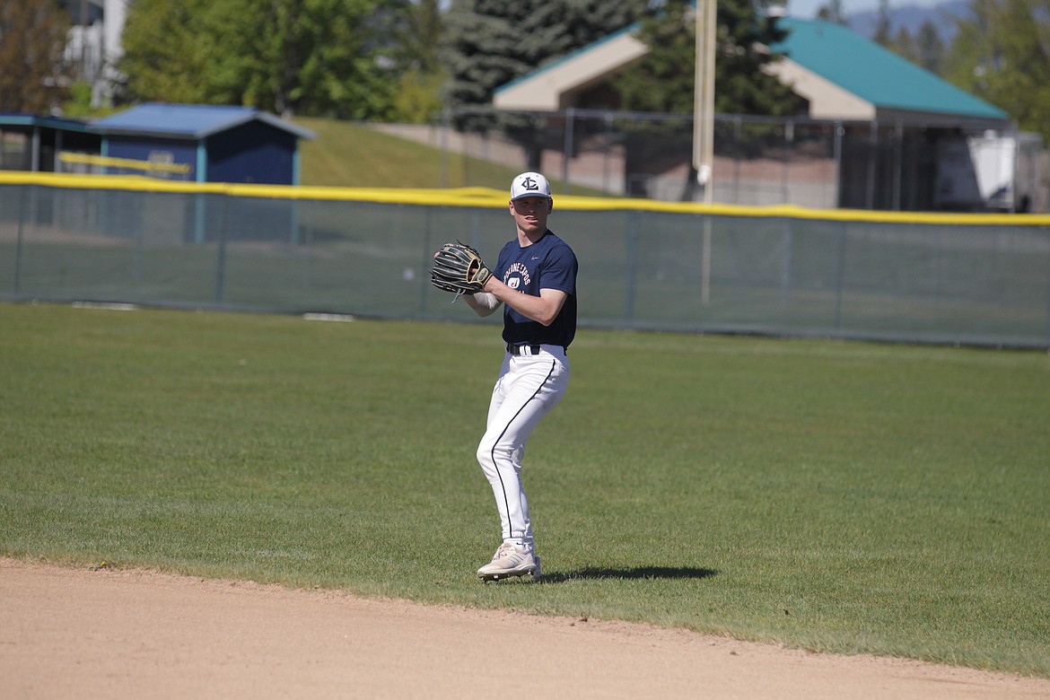 JASON ELLIOTT/Press
Lake City senior Chris Reynolds does some long toss drills during Friday's practice at Lake City High.