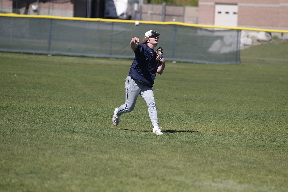 JASON ELLIOTT/Press
Lake City senior pitcher Nate Weatherhead plays long toss with a teammate during Friday's practice.