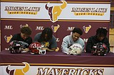 Four Mavs sign to play college football