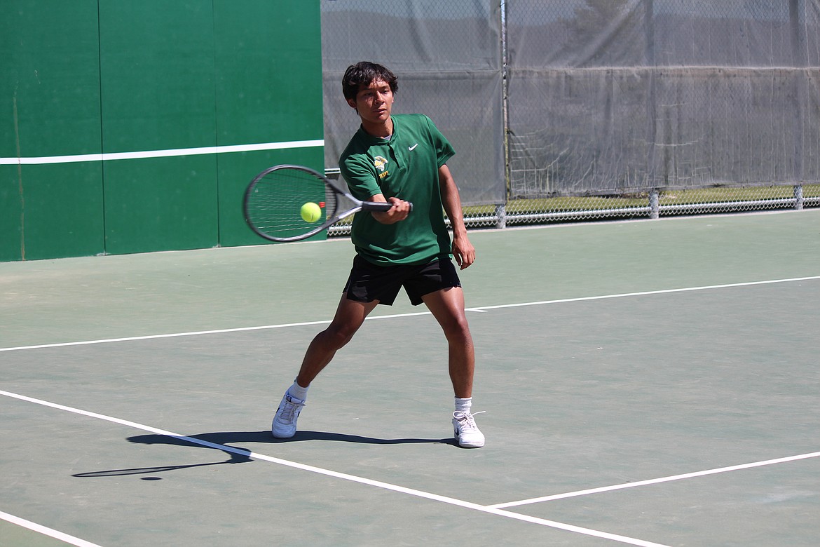 Quincy doubles player Saidt Alvarez returns the ball in the boys Caribou Trail League tournament in Quincy.