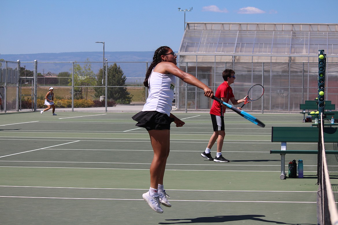 Quincy tennis coach Rollie Ronish said the doubles team of Sopha Navarro, pictured, and Vanessa Quintero played some good tennis during the girls District 6 championships.