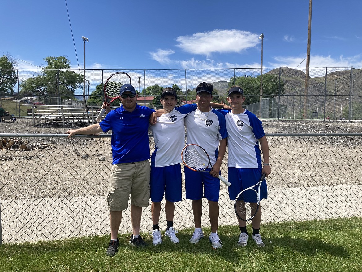 Soap Lake Head Coach Lee Leavell, left, sophomore Xavier Gonzales-Robinson, center left, sophomore Francisco Ortega, middle right and sophomore Logan Northup, right, smile for a photo after winning the Central Washington B league title over the weekend.