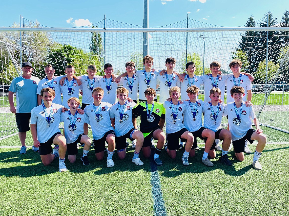 Courtesy photo
The Timbers North FC 2009 boys soccer team won their age division (U15 this year) at the Bill Eisenwinter Hot Shot Tournament for the third year in a row.
All games were played at The Fields at Real Life in Post Falls. In the front row from left are Mason Taylor, Luke Fritts, Kesh Pohlman, Kason Foreman, Grant Johnson, Rowan Wyatt, Blake Wise, Jacob Shaporda nd Jacob Melun; and back row from left, head coach Mike Thompson, Ayden Cragun, Pax Longanecker, Gus Penrose, Taylor Smith, Miles Hart, Creighton Lehosit, Isaac Lowder, Ethan Luna, Brooks Judd and Payson Shaw.
On Friday evening the Timbers beat Nelson Soccer 2-1. Taylor Smith and Mason Taylor scored the goals for the Timbers and Grant Johnson had two saves.
Saturday evening the Timbers beat the Boise Timbers 6-1. Ethan Luna assisted Isaac Lowder on the first goal. Blake Wise chip passed the ball to Luna for the second goal. Luna made another assist for the third goal to Mason Taylor.  The fourth goal was also by Taylor with an assist from Brooks Judd. In the second half, Jacob Melun scored off a corner kick from Luna. The final goal for the Timbers was scored by Jacob Shaporda with an assist by Luke Fritts. Taylor Smith made four saves in goal.
Sunday morning the Timbers beat the Strikers FC 6-0. Defensive player Creighton Lehosit scored two header goals off corner kicks by Mason Taylor early in the first half. Luke Fritts assisted Taylor Smith on the third goal. Ethan Luna scored the fourth goal. Fritts assisted Brooks Judd on the fifth. The final goal was a chip just past the keeper by Taylor Smith off an assist from Mason Taylor. Grant Johnson had the shutout in goal.
In the championship game Sunday afternoon the Timbers beat Glacier Surf SC 5-1. The first goal was scored by Mason Taylor off a deep pass from defensive player Miles Hart. Brooks Judd scored the second goal. Blake Wise assisted Ethan Luna for the third goal. Taylor scored the last two goals, completing the hat trick.
Grant Johnson made two saves for the Timbers.