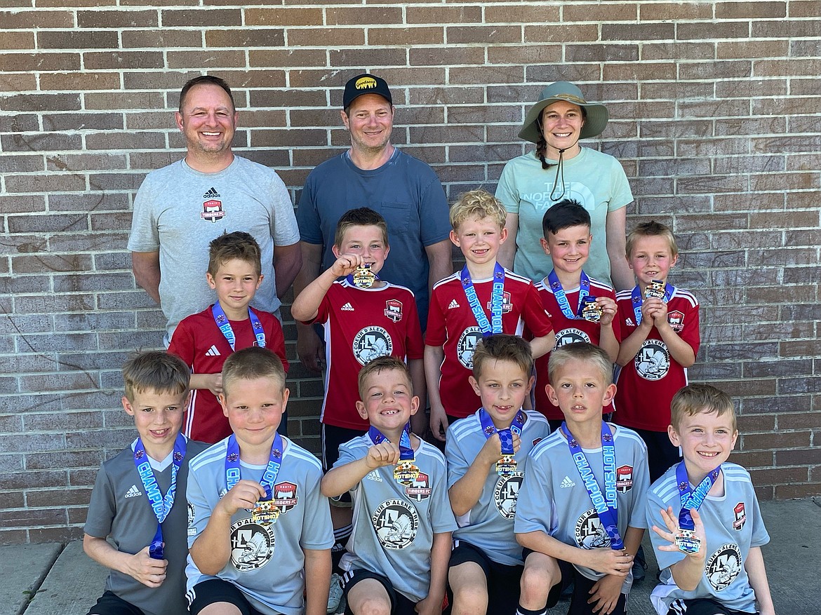 Photo by NICOLE WAYNE
The Timbers North FC 2016 Boys Red and Black Teams went undefeated against Sandpoint Strikers in the four round-robin games Saturday at the Bill Eisenwinter Hot Shot Tournament at Plantes Ferry Sports Complex in Spokane Valley, with the Black Team winning 4-2 and 4-1 and the Red Team winning 8-4 and 7-0. With berths into the Sunday afternoon final already secured, the final round-robin game Sunday morning between the Timbers Red and Timbers Black ended in a 3-3 tie. Sunday’s championship between the Red and Black Team was an exciting back-and-forth match, with the Red Team winning 7-6 for first place and the Black Team took second in the tournament. In the front row from left for the Red Team are Greyson Guy, Isaak Sterling, Elijah Cline, Mitchell Volland, Jaxson Matheney and Leo Leferink; middle row for the Black Team from left, Grayson Martino, Peyton Schock, Ryker Bertek, Xavier Sousley and Kevin Sahm; and back row, head coach Greg Volland, assistant coach Dan Martino and assistant coach Sonia Bertek. Not pictured for Black Team are Jackson Martin and Emmett Cowan.