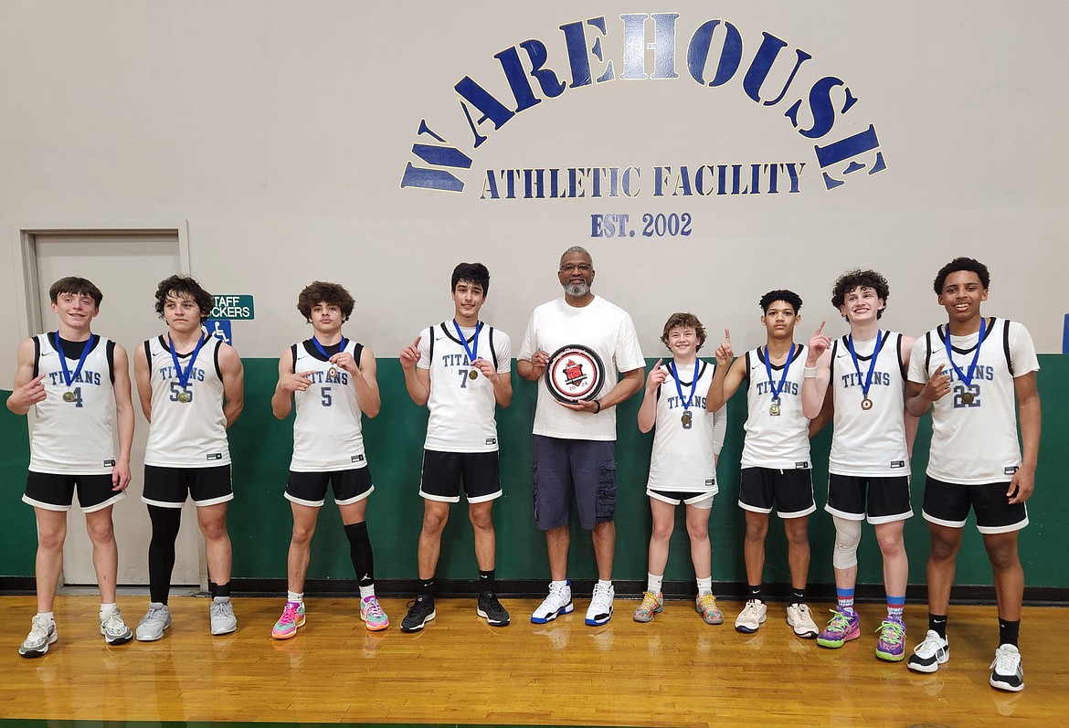 Courtesy photo
The Titans AAU boys basketball team defeated Team Slime on Sunday in the ninth grade boys division championship of May Madness at the Warehouse in Spokane. From left are Evan Drew, Rex Arroyo,  Makya Quincy (Post Falls), Arjun Kandola, coach Leon Sayers, Sawyer Norisada (Post Falls), Jakolbe Lopp, Wallace Frates and Miles Spencer.