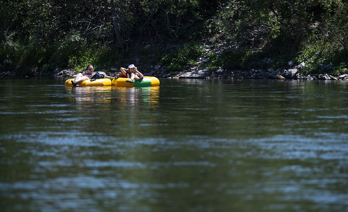 Missoulians cool off in the Clark Fork River on Wednesday, June 30, 2021. (AP Photo/Tommy Martino)