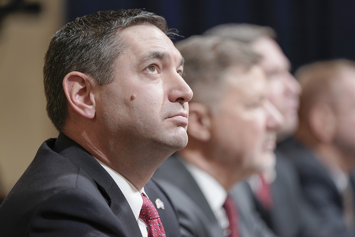 Montana Attorney General Austin Knudsen, left, testifies during a House Committee on Homeland Security hearing on Capitol Hill, Wednesday, Jan. 10, 2024, in Washington. (AP Photo/Mariam Zuhaib)