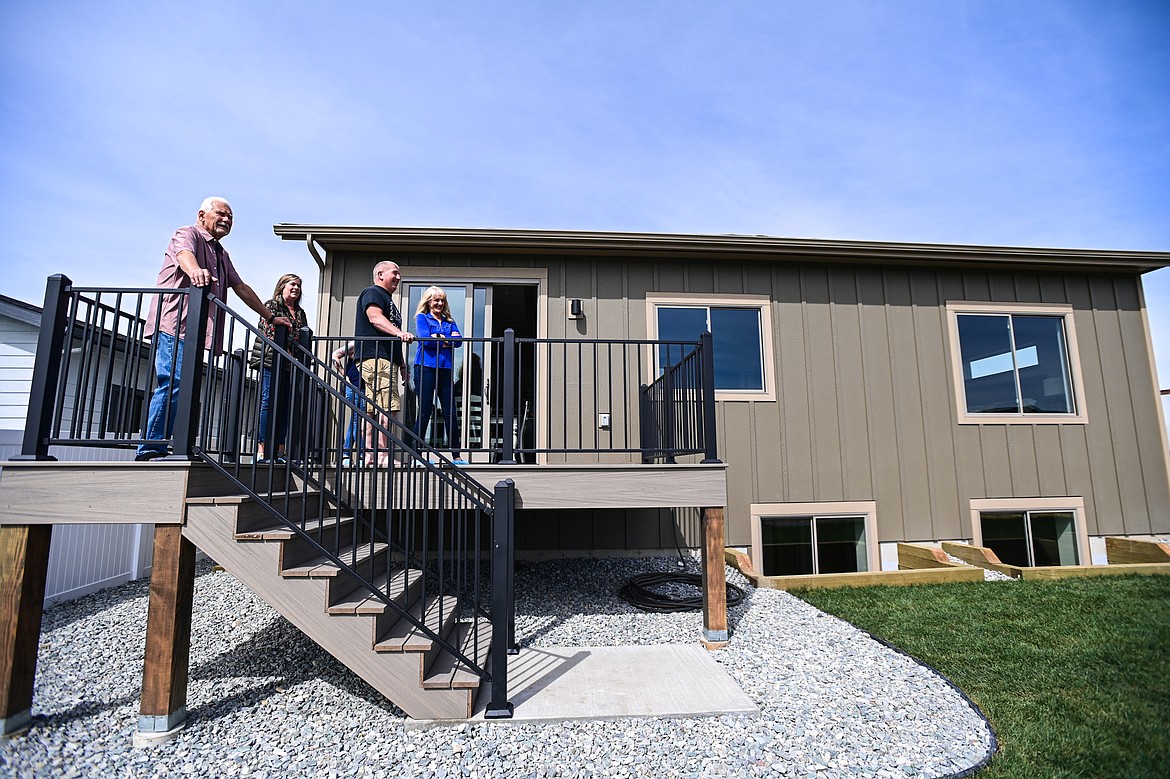 Brock Anderson, lead instructor with the Student Built Homes program at Kalispell Public Schools, gives a tour during an open house to showcase the program's latest finished home at 225 Northridge Way in Kalispell on Wednesday, May 15. (Casey Kreider/Daily Inter Lake)