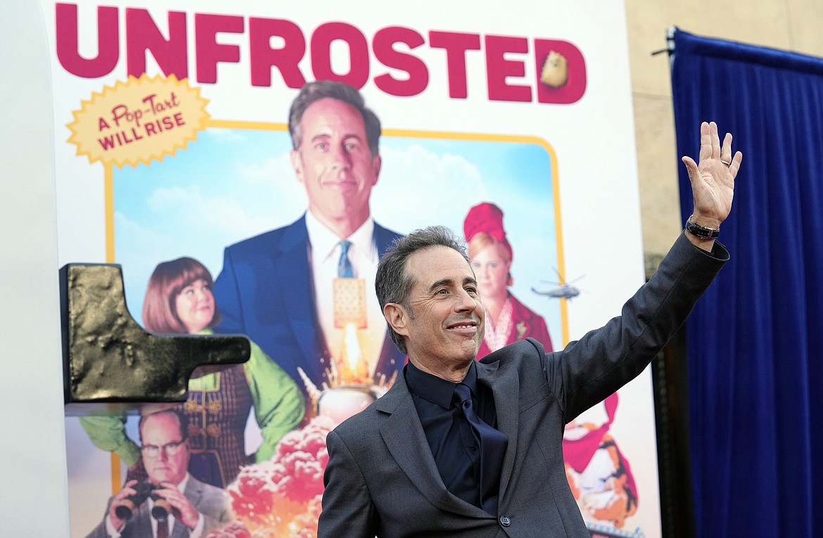 Jerry Seinfeld, the writer/director/star of "Unfrosted," waves to photographers at the premiere of the Netflix film at the Egyptian Theatre, April 30, in Los Angeles.