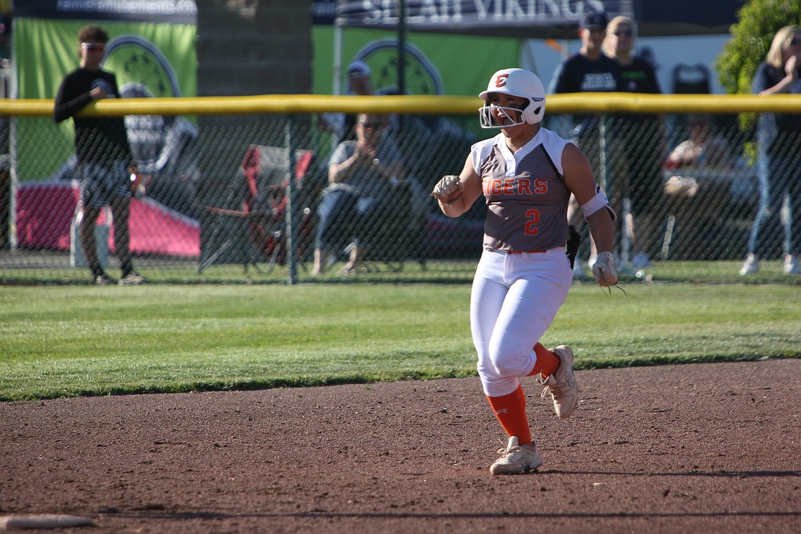 Ephrata junior Kaydence Hector celebrates while trotting the bases after hitting a two-run home run in the top of the first inning against Othello on Tuesday. Hector led the Tigers with three RBI.